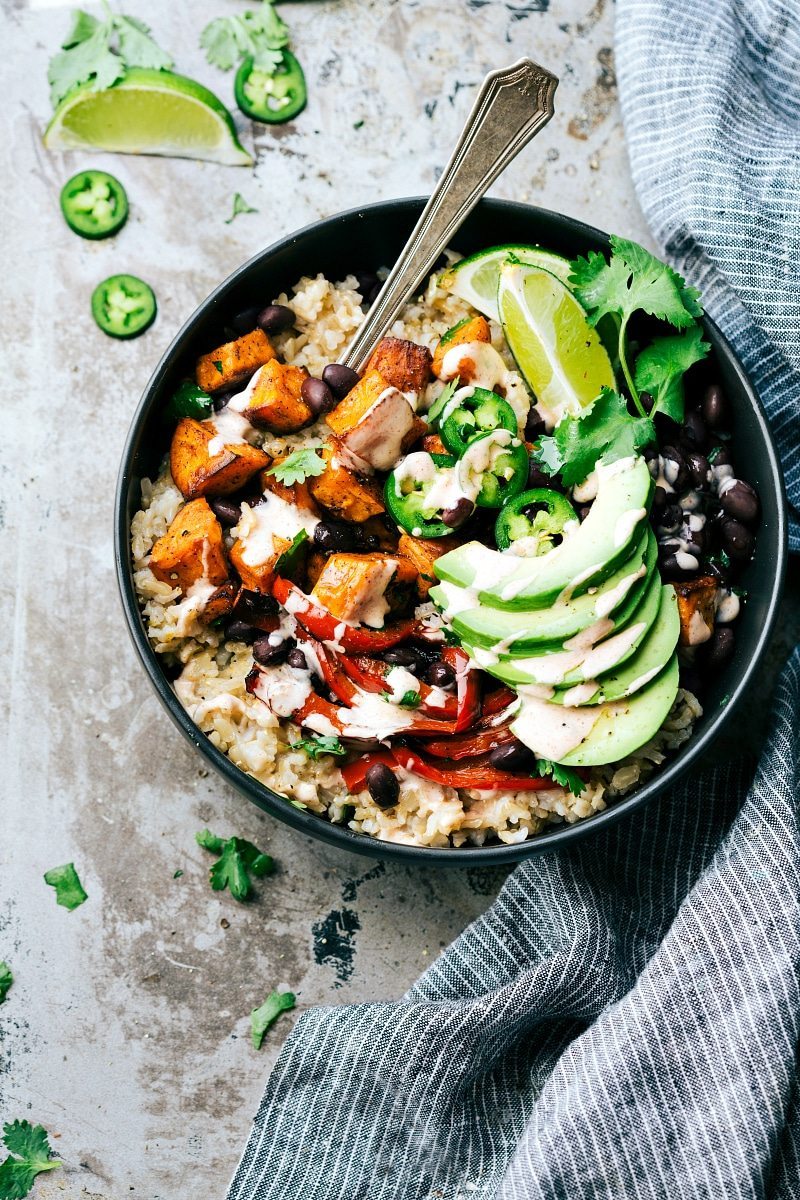 SWEET POTATO BURRITO BOWLS! A delicious and simple to make veggie black bean burrito bowls -- brown rice, seasoned & roasted sweet potatoes + bell peppers, black beans, and avocado with the most incredible chipotle lime sauce. via chelseasmessyapron.com