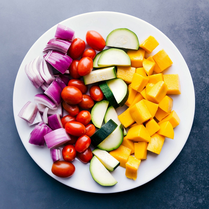 Overhead image of the fresh fruit and veggies on a plate before being grilled