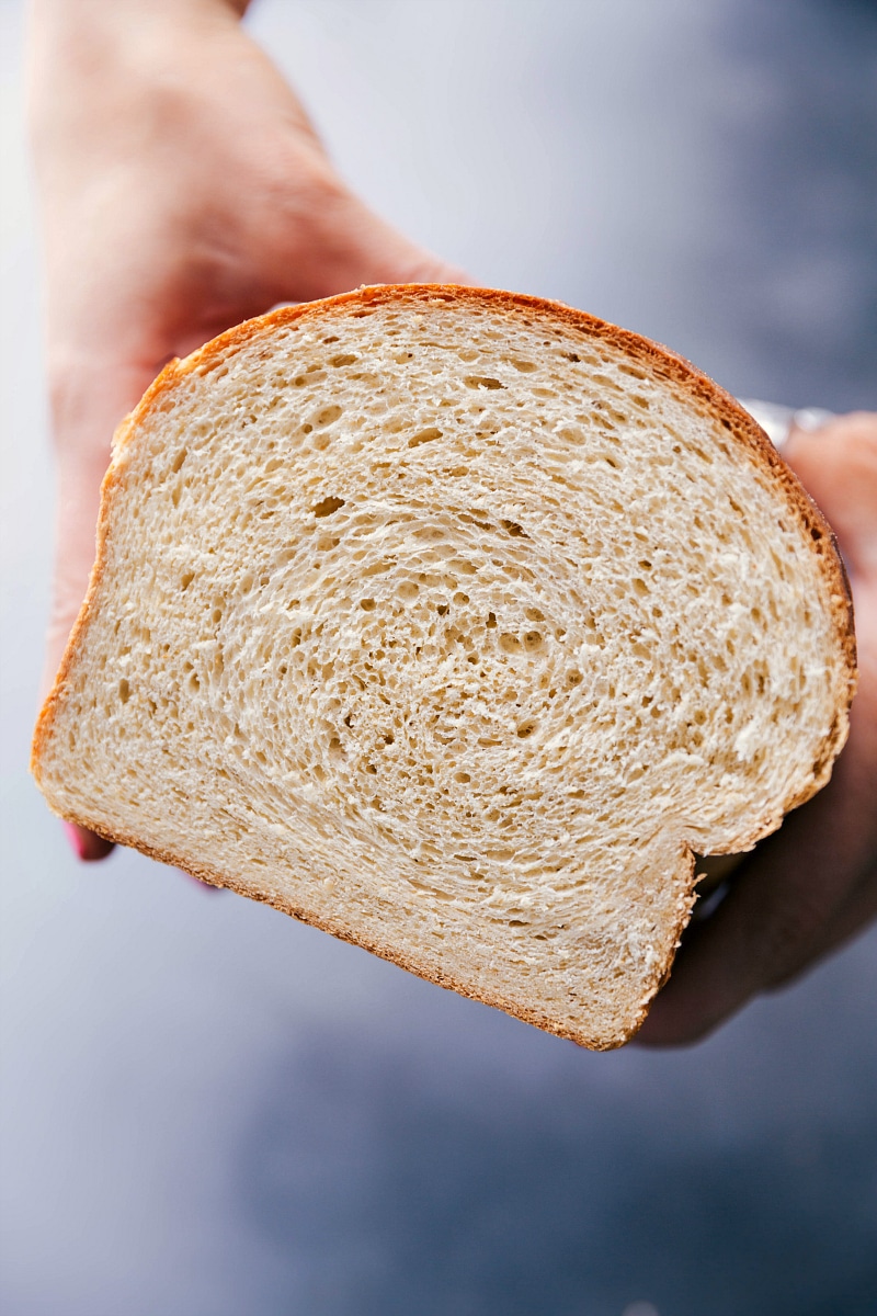 Sliced honey whole wheat bread revealing its soft, fluffy interior.