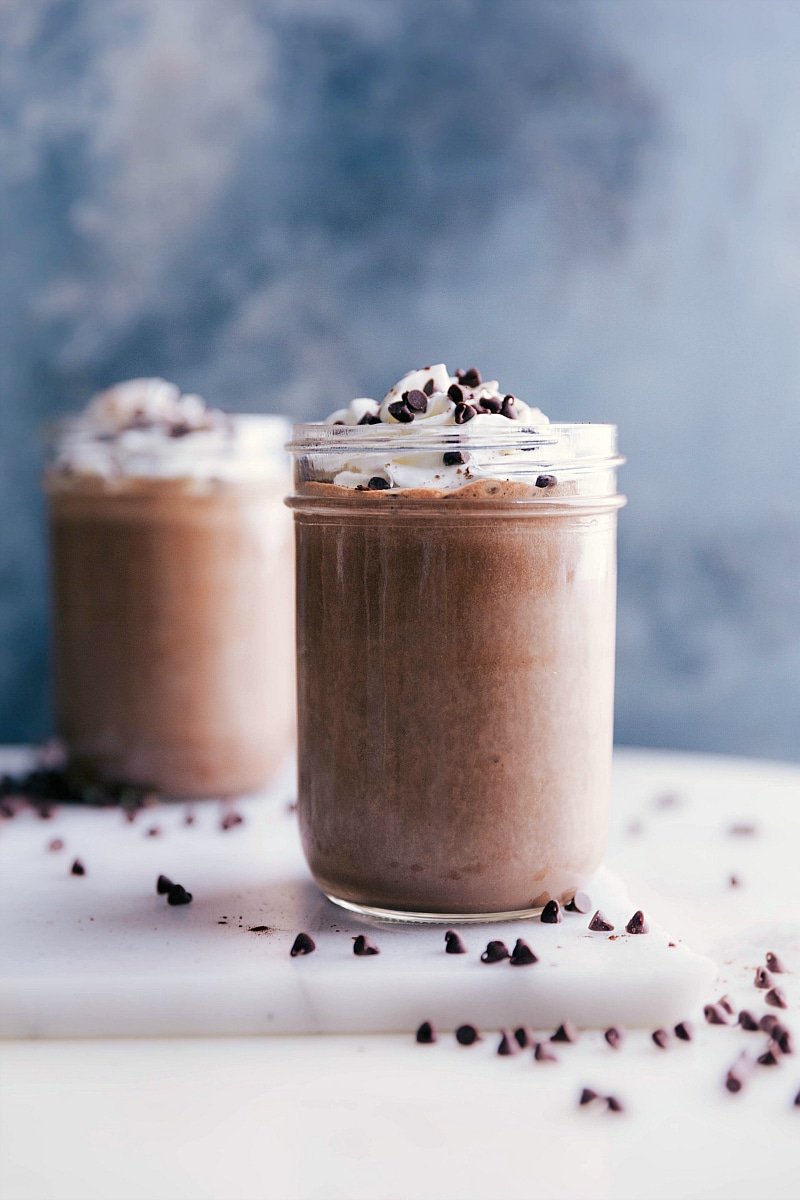  Chocolate Protein Shake in a cup with whipped cream, ready to be enjoyed.