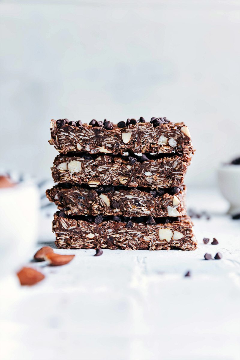 Four chocolate chip granola bars, sliced to reveal their delicious interiors filled with healthy and complimentary flavors, and loaded with chocolate chips.