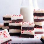 Peppermint Fudge, cut into squares and stacked on top of each other.