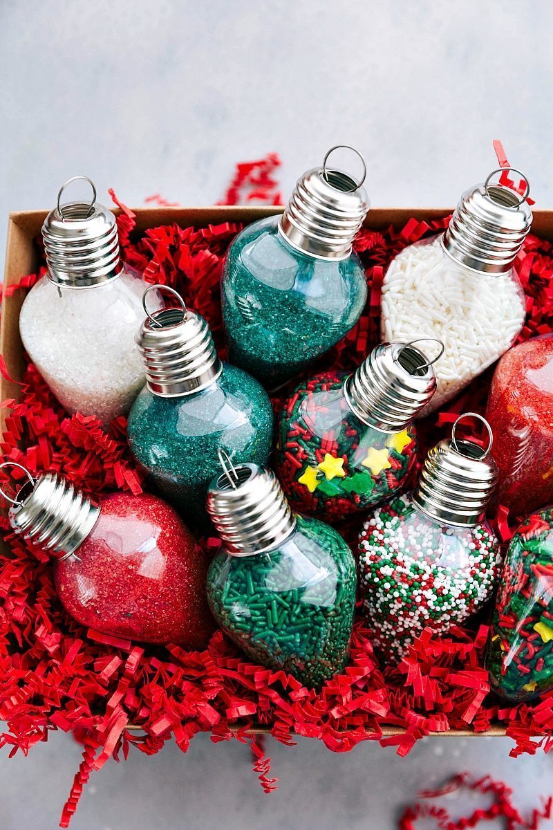 Overhead view of a box full of ornaments filled with cookie sprinkles