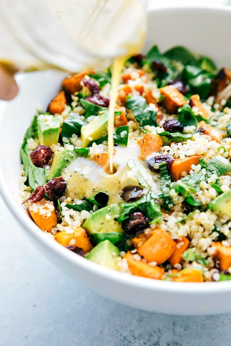 Roasted sweet potato and quinoa salad! Fresh and healthy roasted sweet potato and quinoa salad made with spinach and avocados. A healthy and delicious lemon vinaigrette dressing coats this salad. from chelseasmessyapron.com