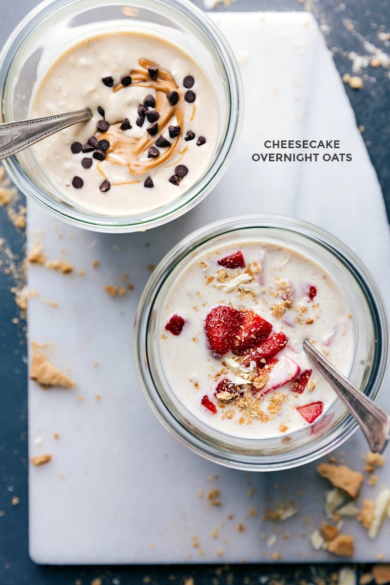 Two variations of cheesecake overnight oats: one with peanut butter and the other with strawberries.