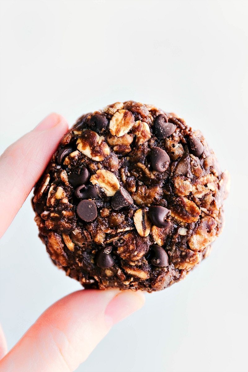 Chocolate-Peanut Butter Breakfast Cookies being held to show size and texture