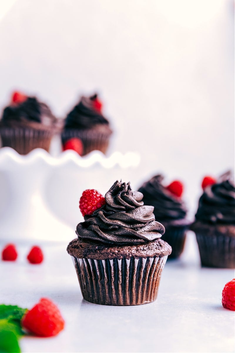 Cake Mix Cupcakes with frosting and fresh raspberries on top