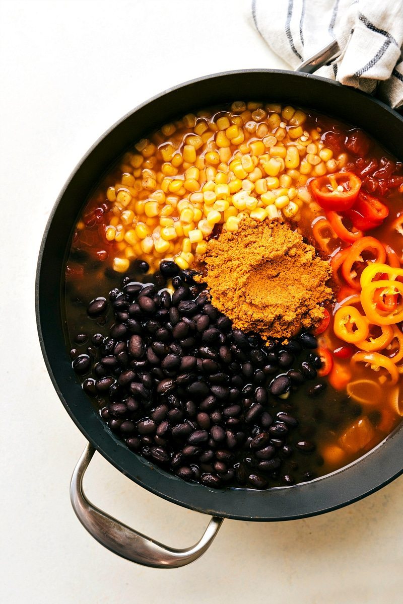 An easy ONE SKILLET chicken enchilada pasta dish that comes together in less than thirty minutes. A meal the whole family will love! Recipe via chelseasmessyapron.com