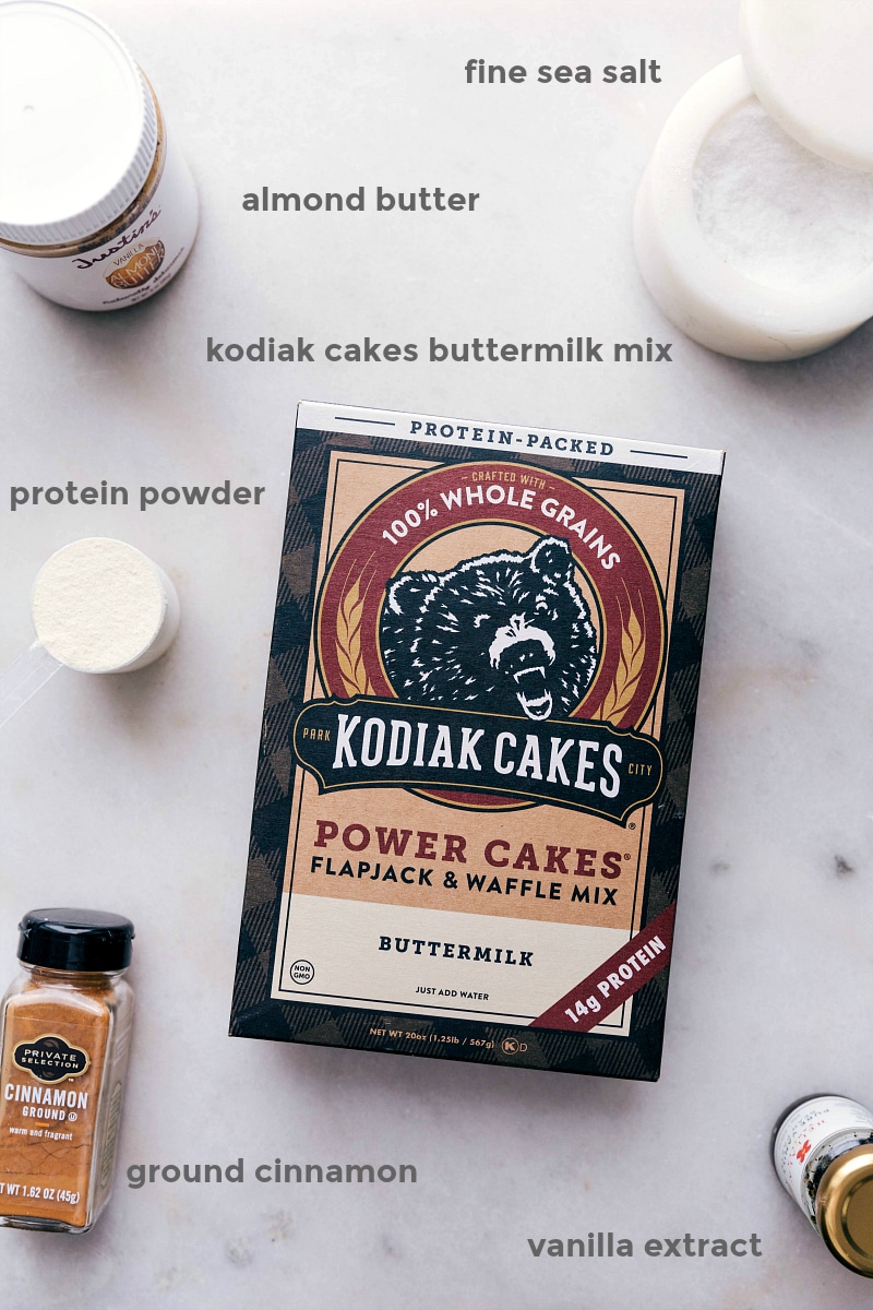 Assortment of ingredients for the high protein breakfast cookies, featuring Kodiak Cakes buttermilk mix and more.