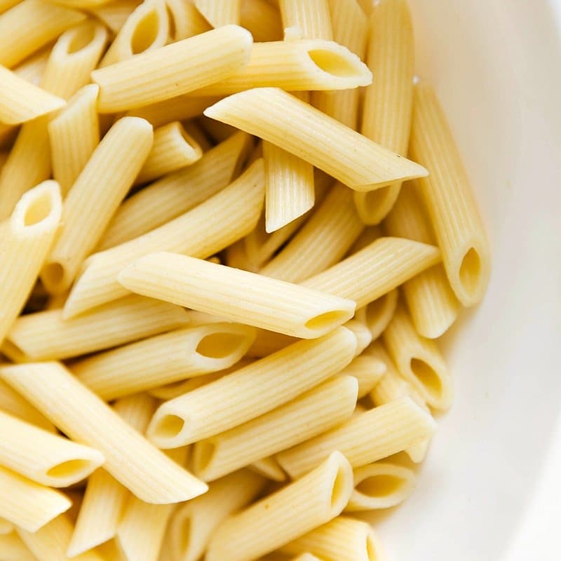 Cooked penne noodles prepared and ready to be combined with the flavorful sauce.