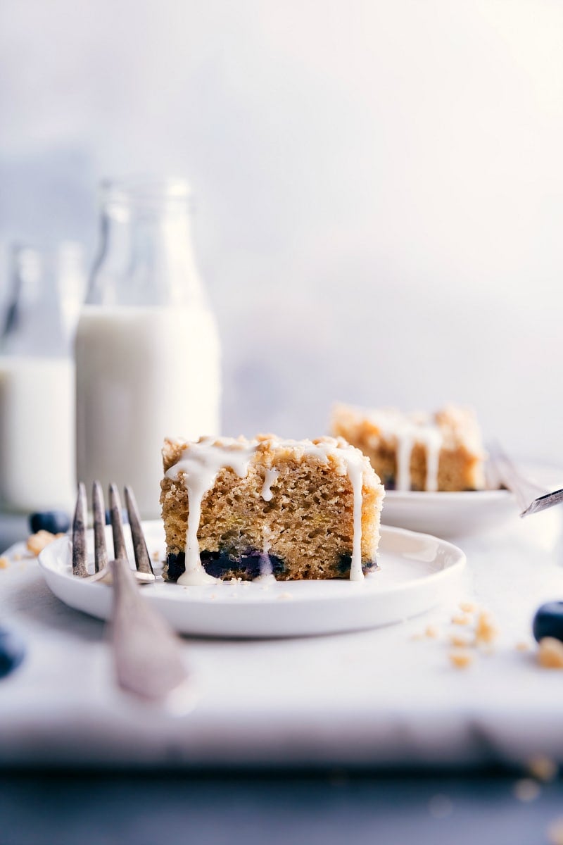 Piece of coffee cake on a plate, with a fork on the side.