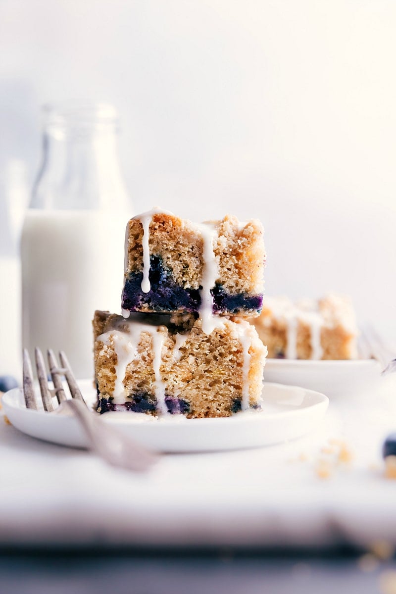 Close-up view of two squares of coffee cake, stacked on each other.