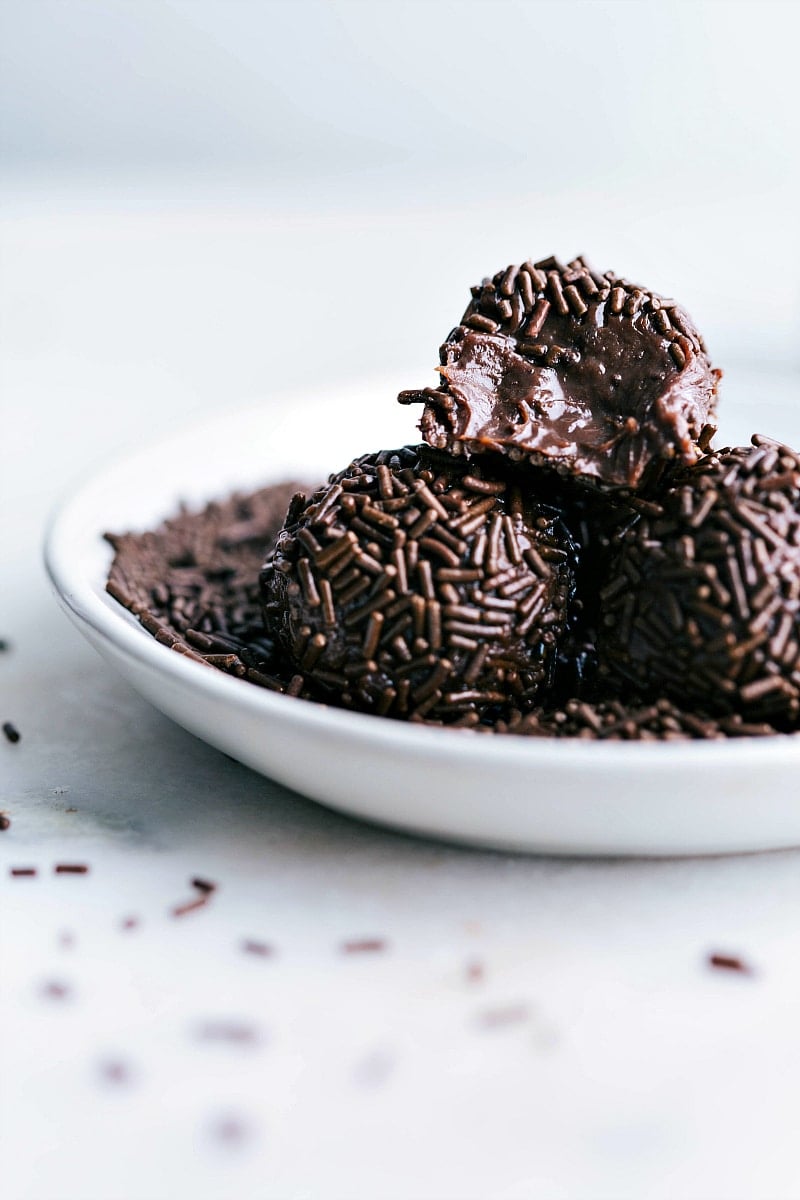 Image of the Brigadeiros with a bite out of one of them.