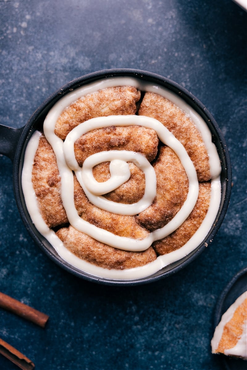 Overhead image of the Cinnamon Roll Cake with frosting swirled on top