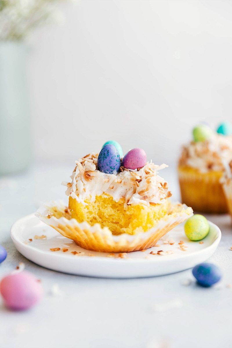 Bite taken out of a cupcake with other Easter cupcakes in the background