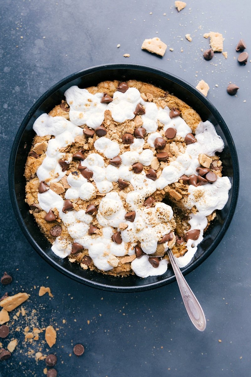 Freshly baked s'mores pizookie, warm and gooey, inviting a sweet dessert indulgence.