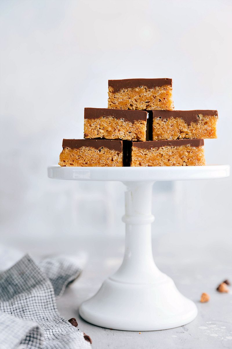 Image of the Scotcheroo bars displayed on a cake stand.