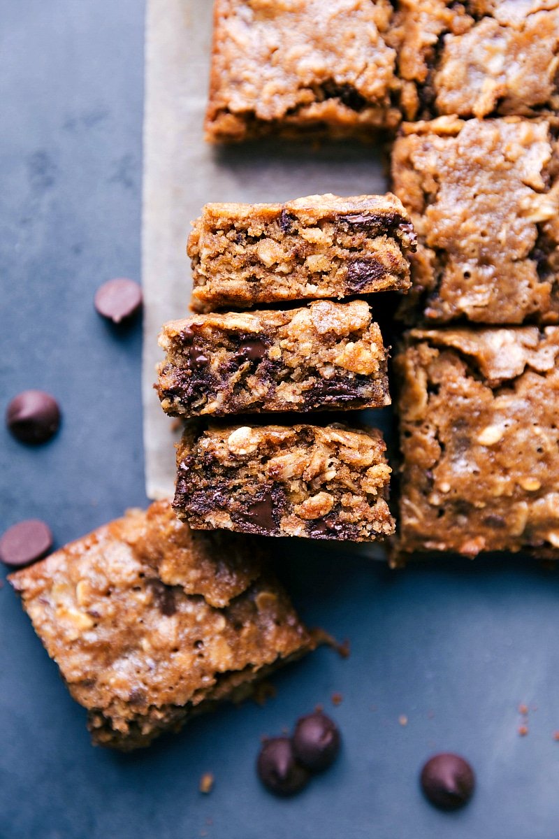 Warm, chewy soft-baked oatmeal breakfast bars, cut into squares and ready to be eaten.