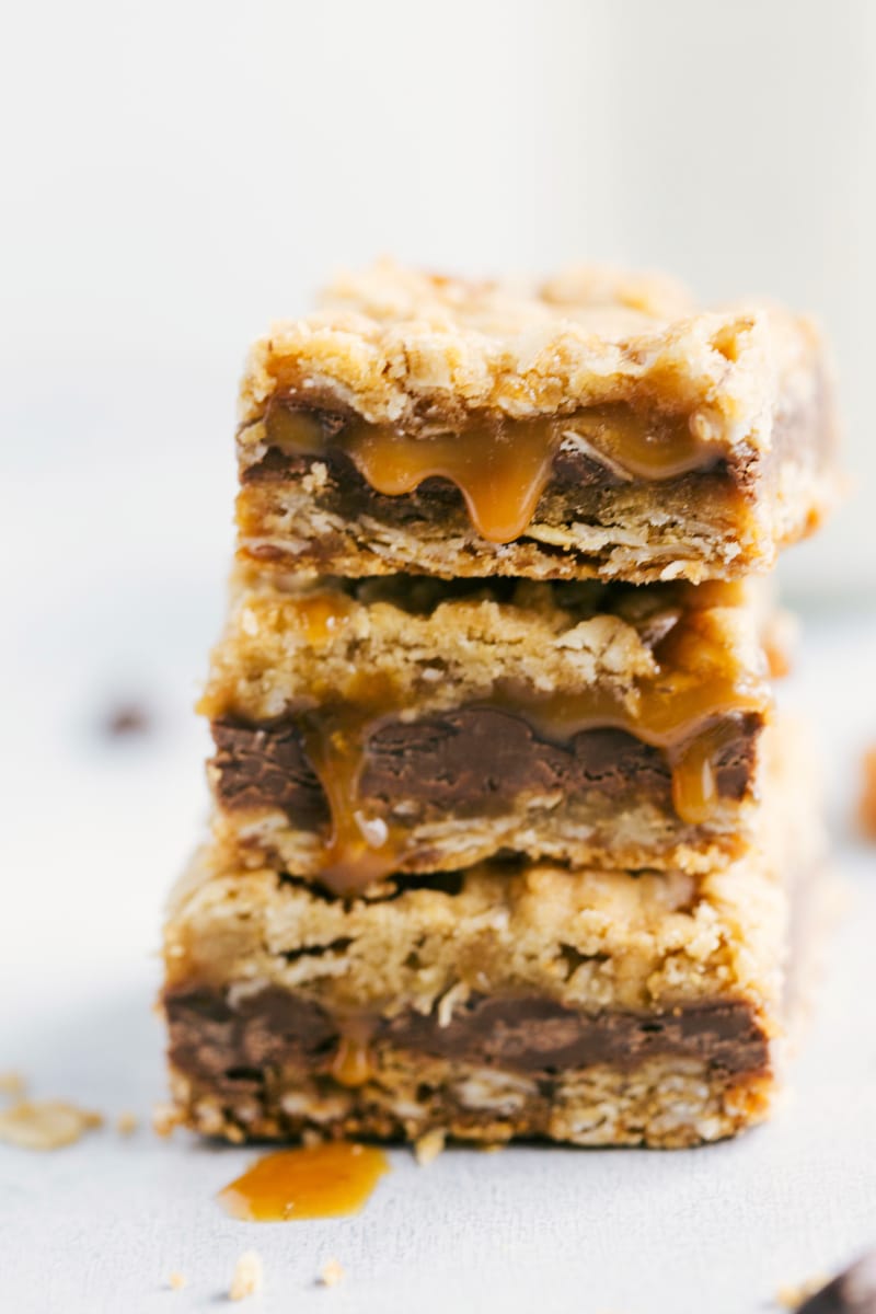 Front shot of caramel dripping from 3 stacked carmelitas