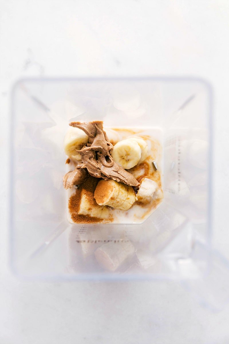 Overhead view of the Banana Smoothie ingredients in a blender jar, ready to be processed.