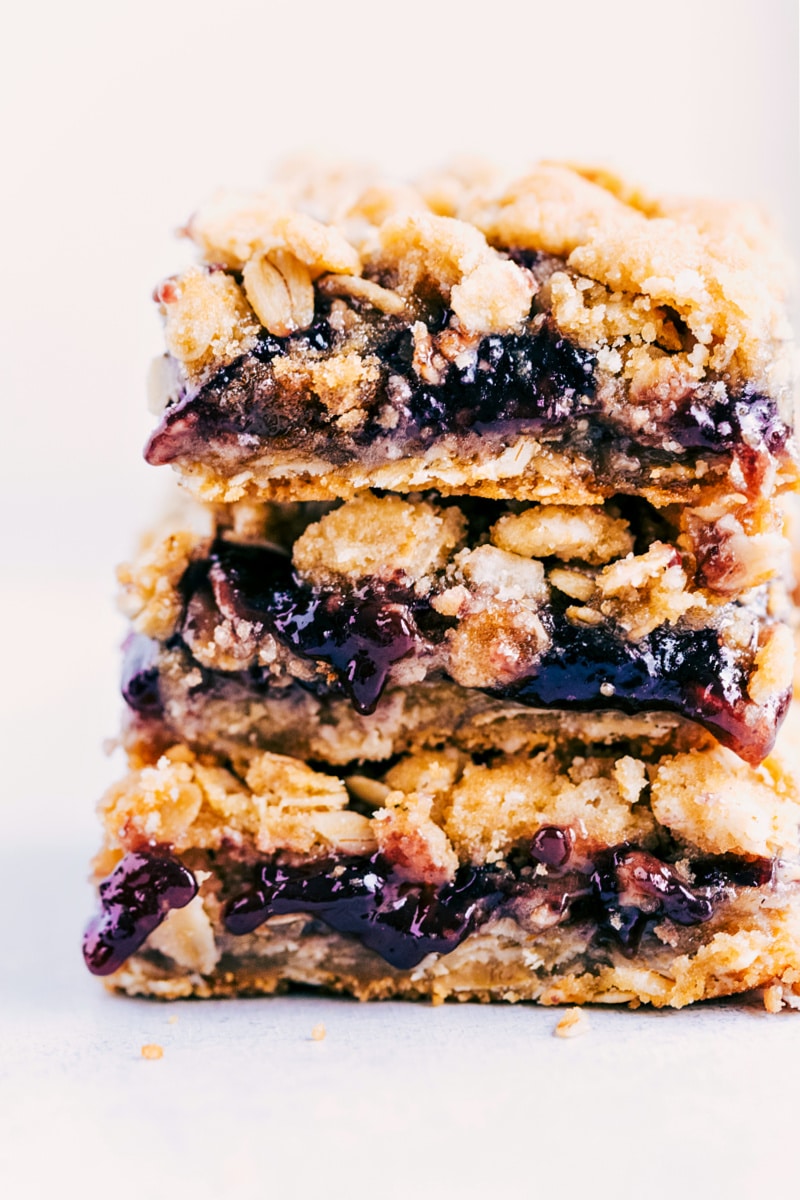 Up close image of the oatmeal jam bar stacked on top of each other
