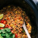 Tex mex quinoa in crockpot full of flavor with fresh vegetables and cilantro.