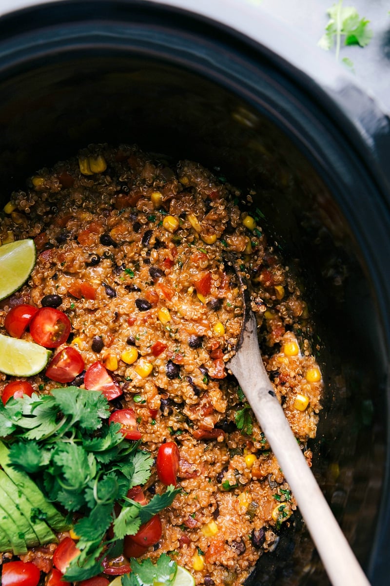 Tex mex quinoa in crockpot full of flavor with fresh vegetables and cilantro.