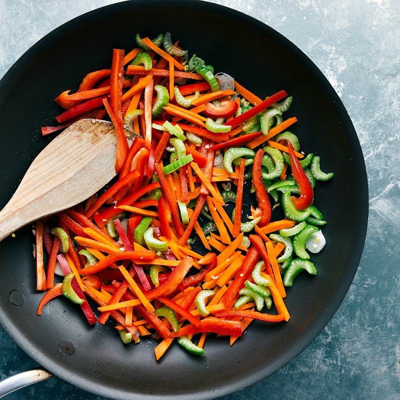 Overhead image of the vegetables being cooked in a skillet.