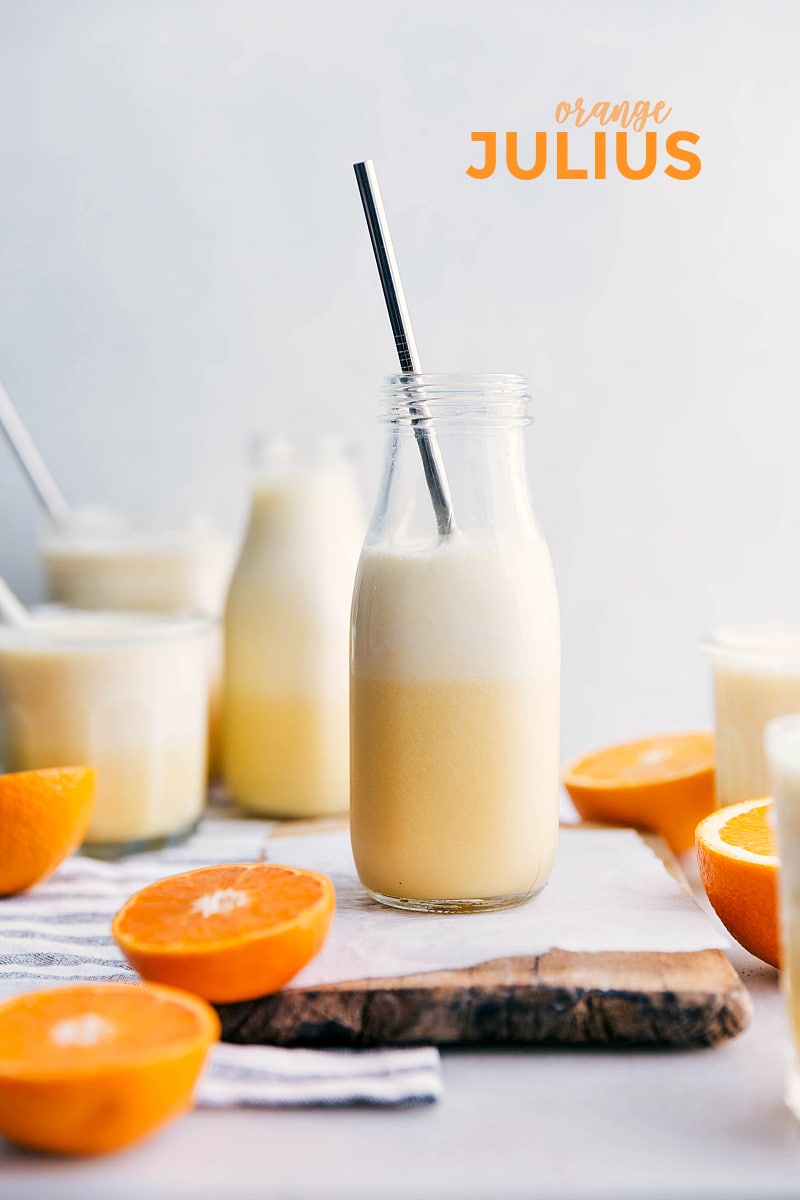 A copycat orange Julius recipe A couple cups of Orange Julius with fresh oranges on the side.