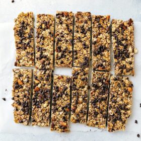 Delicious homemade granola bars, full of chocolate chips, cut into portions, and ready to be enjoyed.