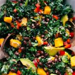 Ready-to-eat kale couscous salad, freshly dressed and garnished.