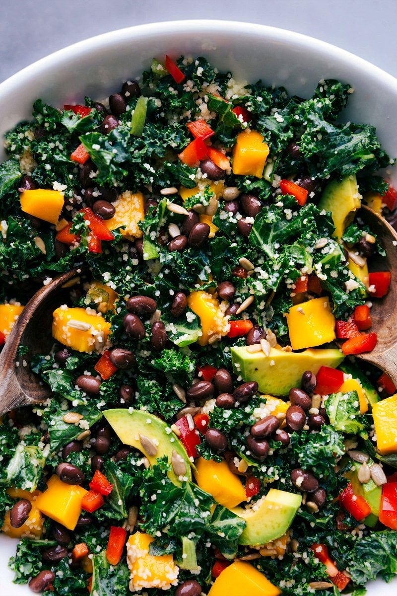 Ready-to-eat kale couscous salad, freshly dressed and garnished.