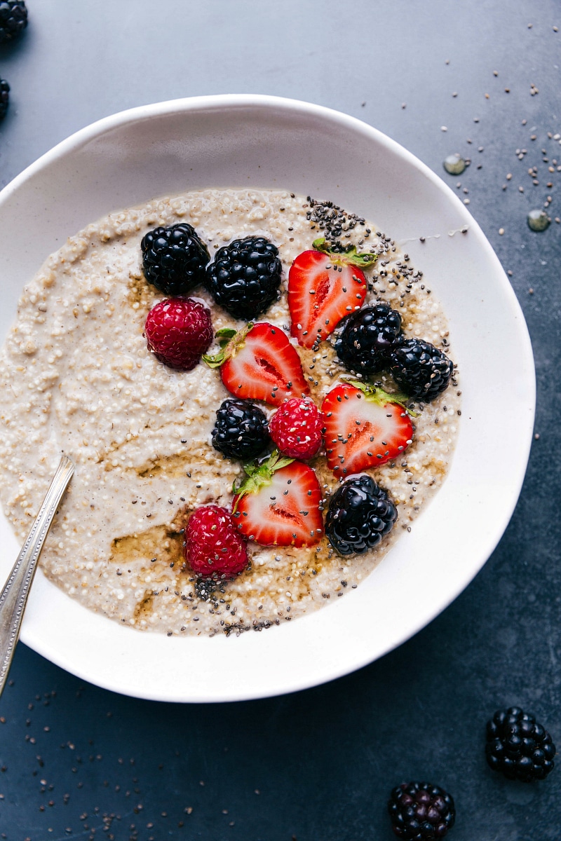 Finished breakfast dish topped with fresh berries, chia seeds, and honey, offering a warm and healthy start to the day.