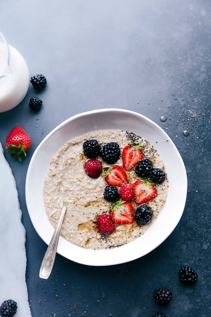 Delicious and warm overnight steel cut oatmeal topped with fresh berries, making a perfect breakfast dish.