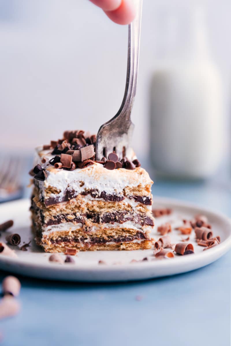 Image of the S'mores Icebox Cake on a plate with a fork going into it