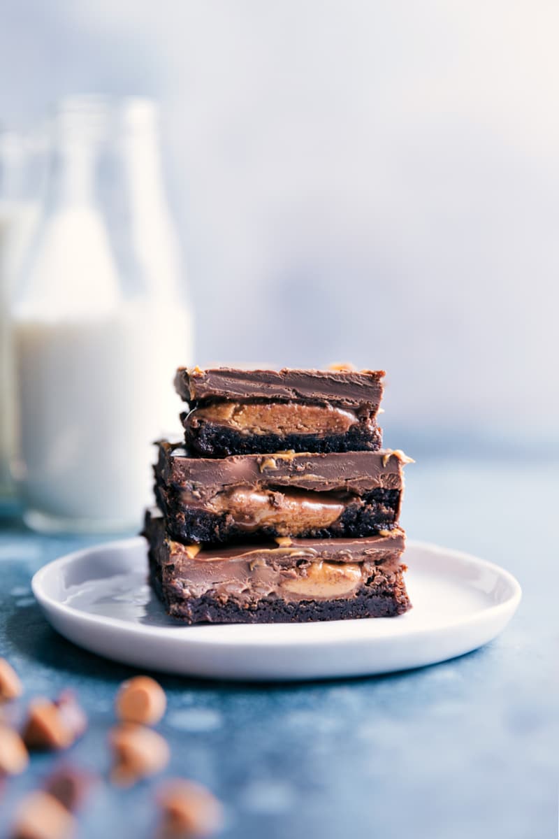 Peanut Butter Cup Brownies stacked on top of each other