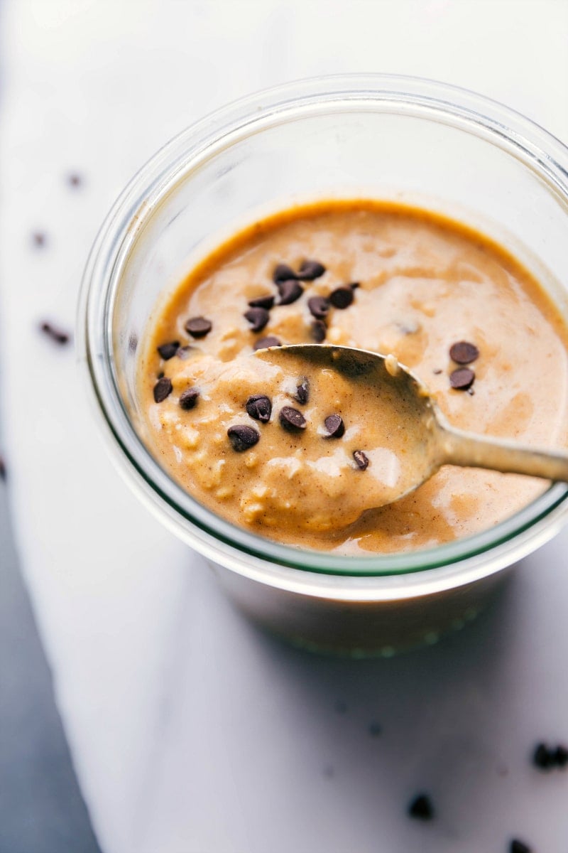 Image of Pumpkin Overnight Oats with a spoonful being taken out of it.