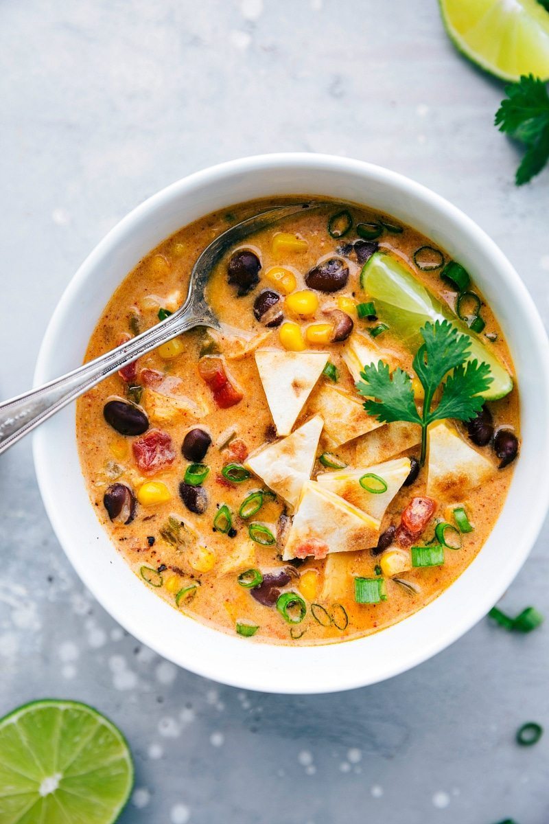 Overhead image of the chicken quesadilla soup ready to eat with a spoon in it