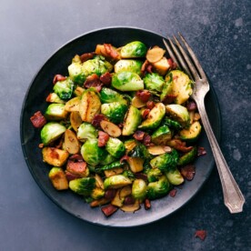 Brussels sprouts and bacon on a plate, cooked to perfection and ready to be enjoyed.
