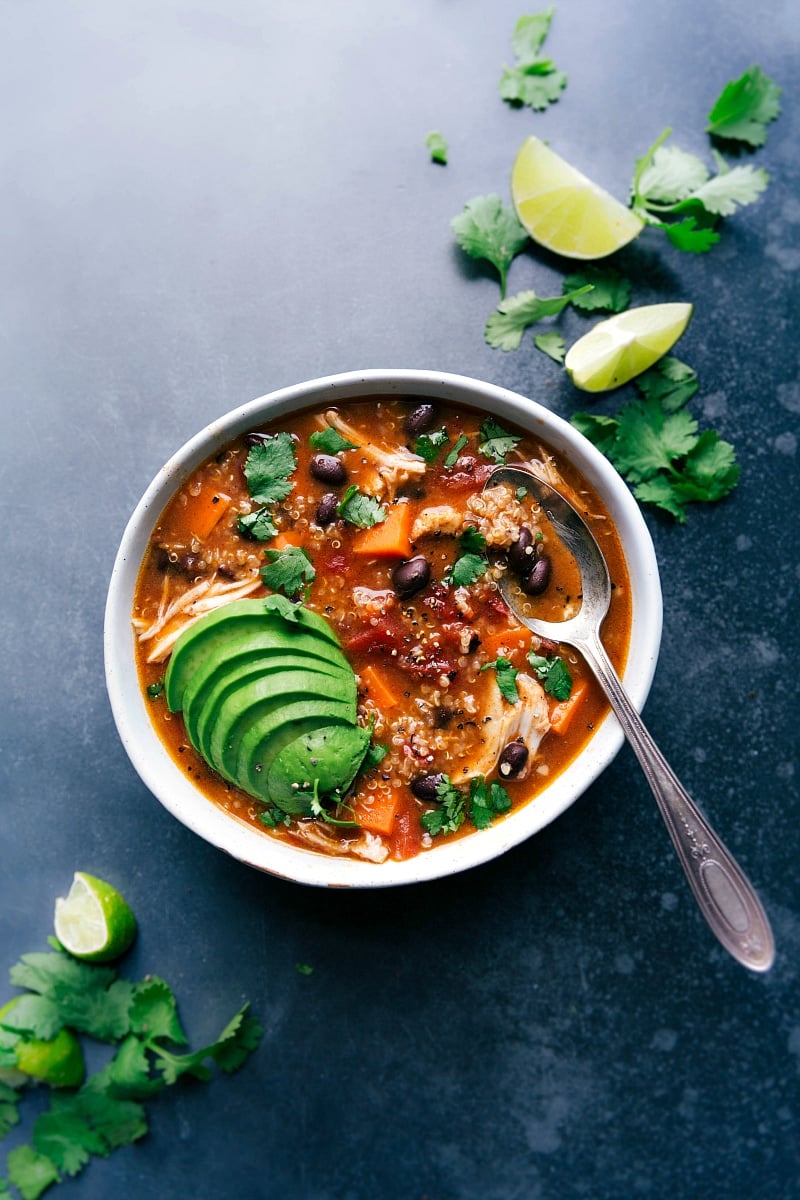 A bowl filled with chicken sweet potato soup, a healthy and hearty meal that's warm and full of flavor.