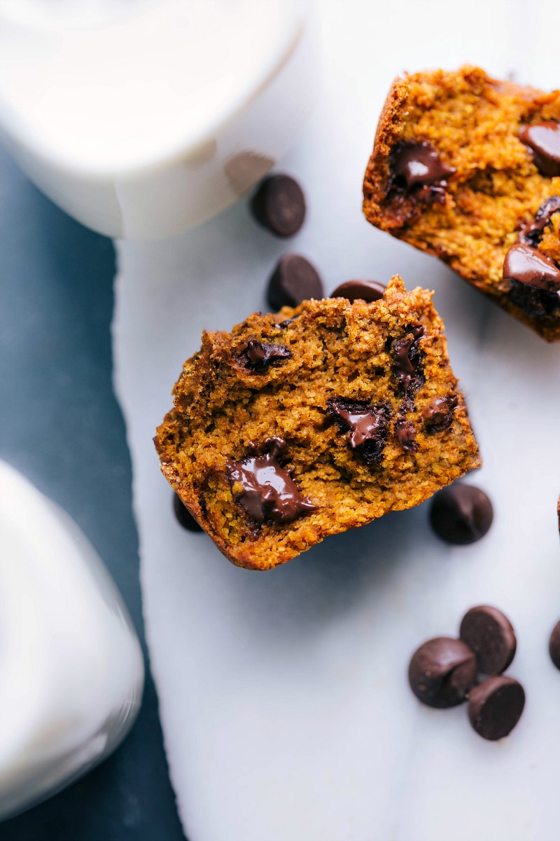 Pumpkin healthy muffins split in half to reveal their delicious and moist interior.
