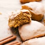 Pumpkin scones with a delectable bite missing.