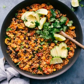 One-skillet sweet potato burrito bowl loaded with toppings, served in the skillet.