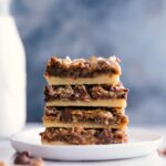 Stacked seven-layer pumpkin bars, a delicious treat ready to be enjoyed.