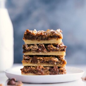 Stacked seven-layer pumpkin bars, a delicious treat ready to be enjoyed.