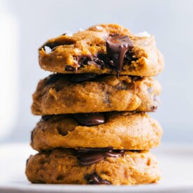 Stack of cake mix pumpkin cookies, freshly baked with a golden-brown hue, ready for serving.