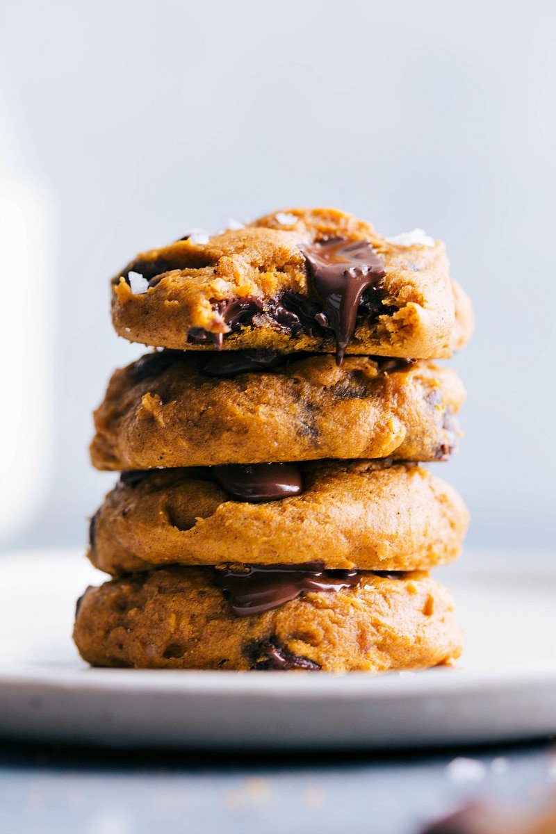 Stack of cake mix pumpkin cookies, freshly baked with a golden-brown hue, ready for serving.