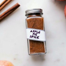 Container of fragrant apple pie spice, a versatile spice blend.