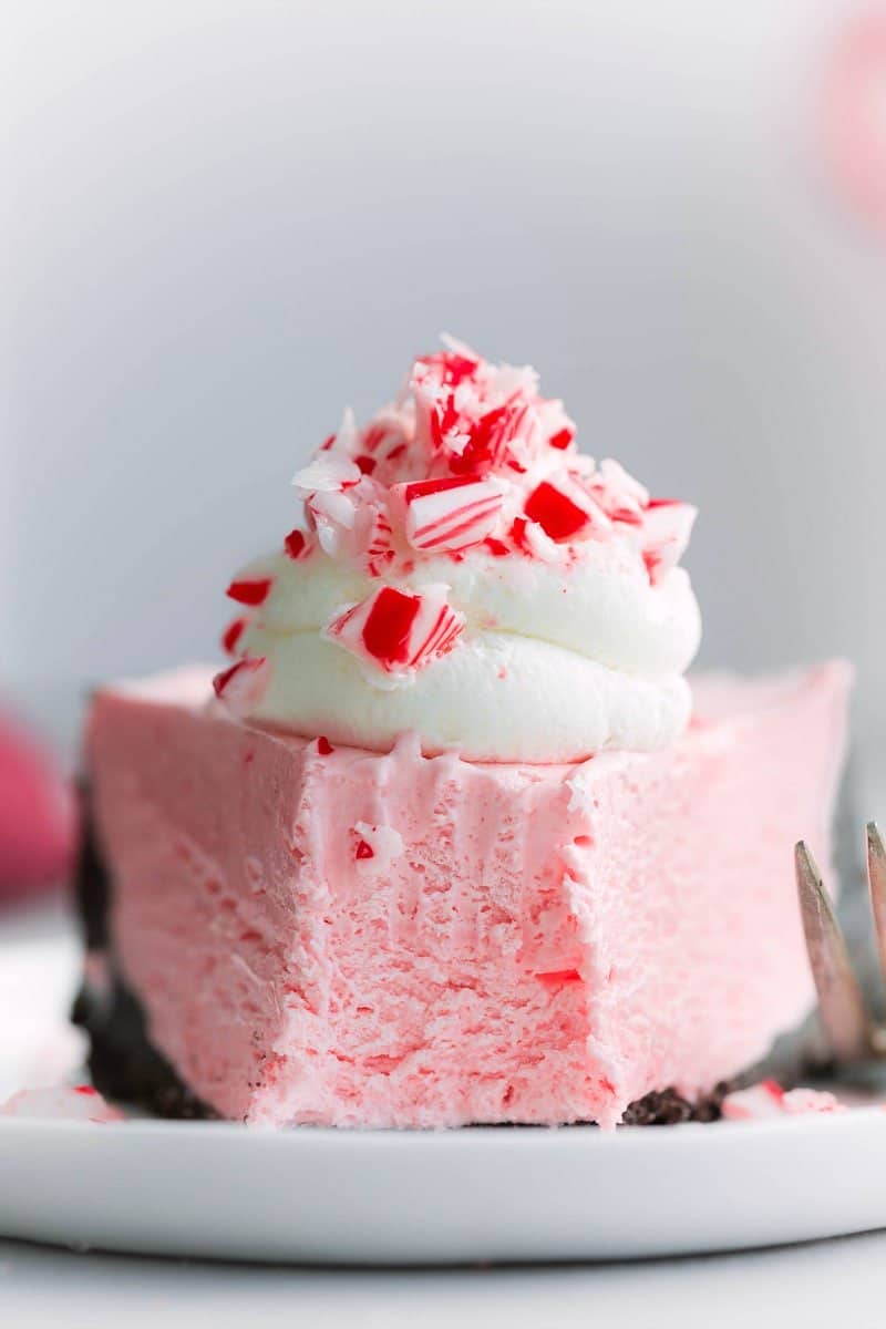 Image of a slice of the No-Bake Peppermint Cheesecake with a bite taken out of it