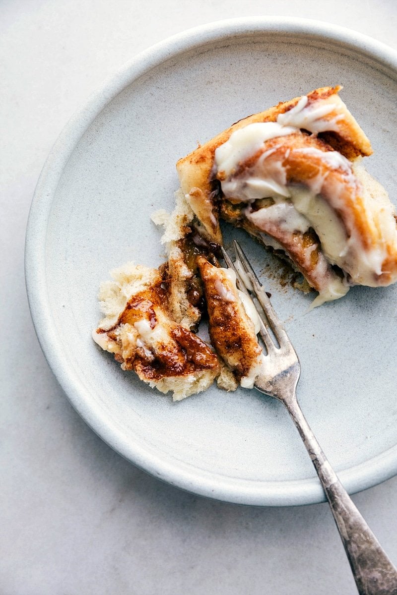 A shot of the finished Homemade Cinnamon Roll being eaten.